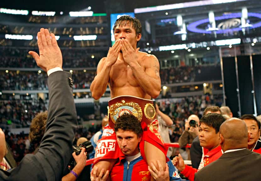 Manny Pacquiao (top) celebrates his welterweight title fight win over Joshua Clottey...