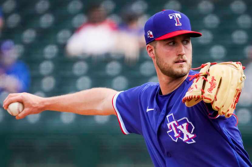 Rangers pitcher Kyle Cody delivers during the fourth inning of a spring training game...