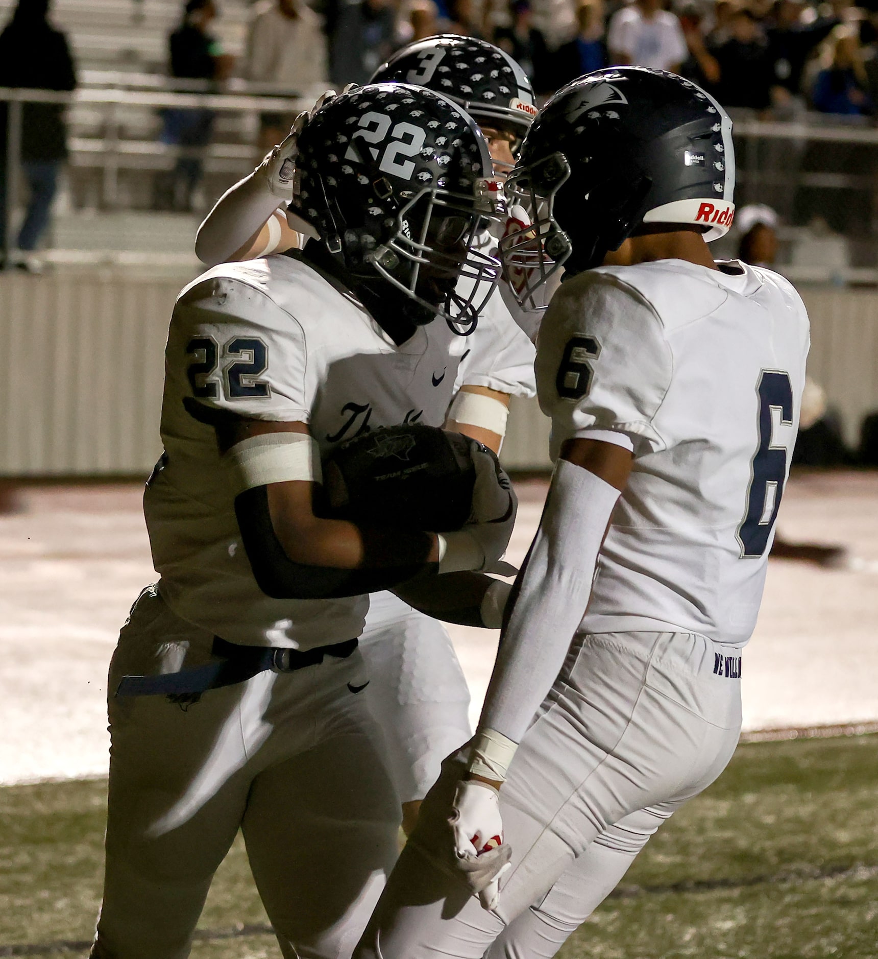 Flower Mound running back Marcus Simpson (22) celebrates with wide receiver Tre Brown (6)...