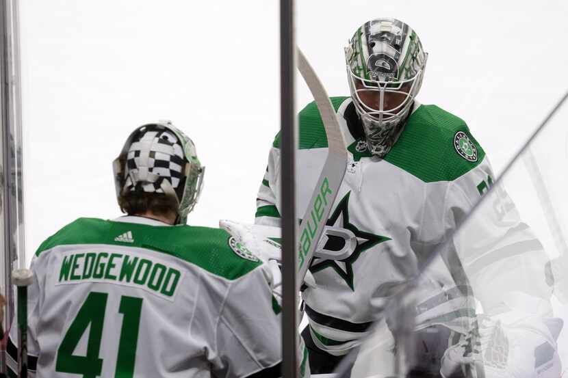 Dallas Stars goaltender Scott Wedgewood, left, replaces goaltender Jake Oettinger during the...