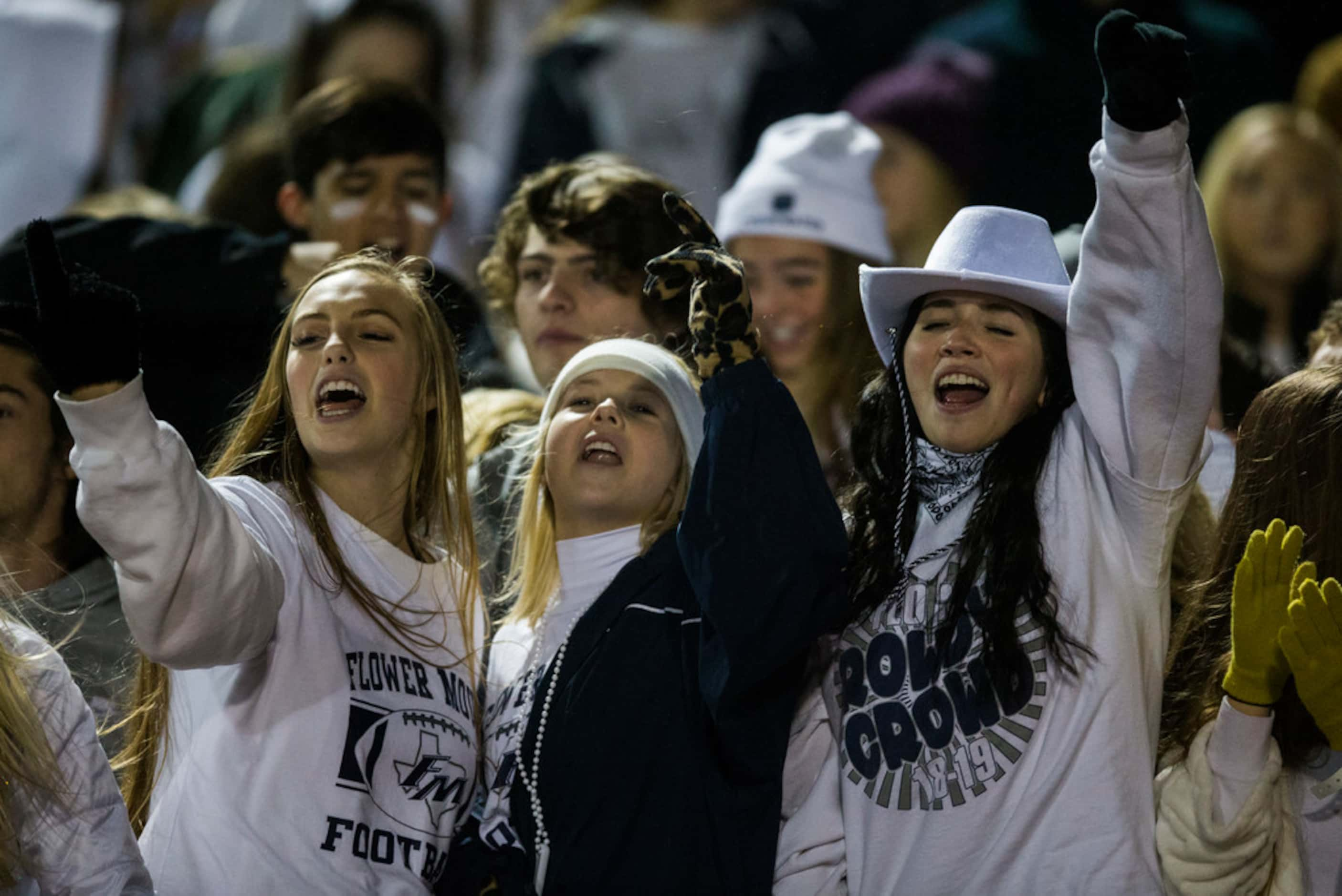 Flower Mound fans cheer before a District 6-6A high school football game between Flower...