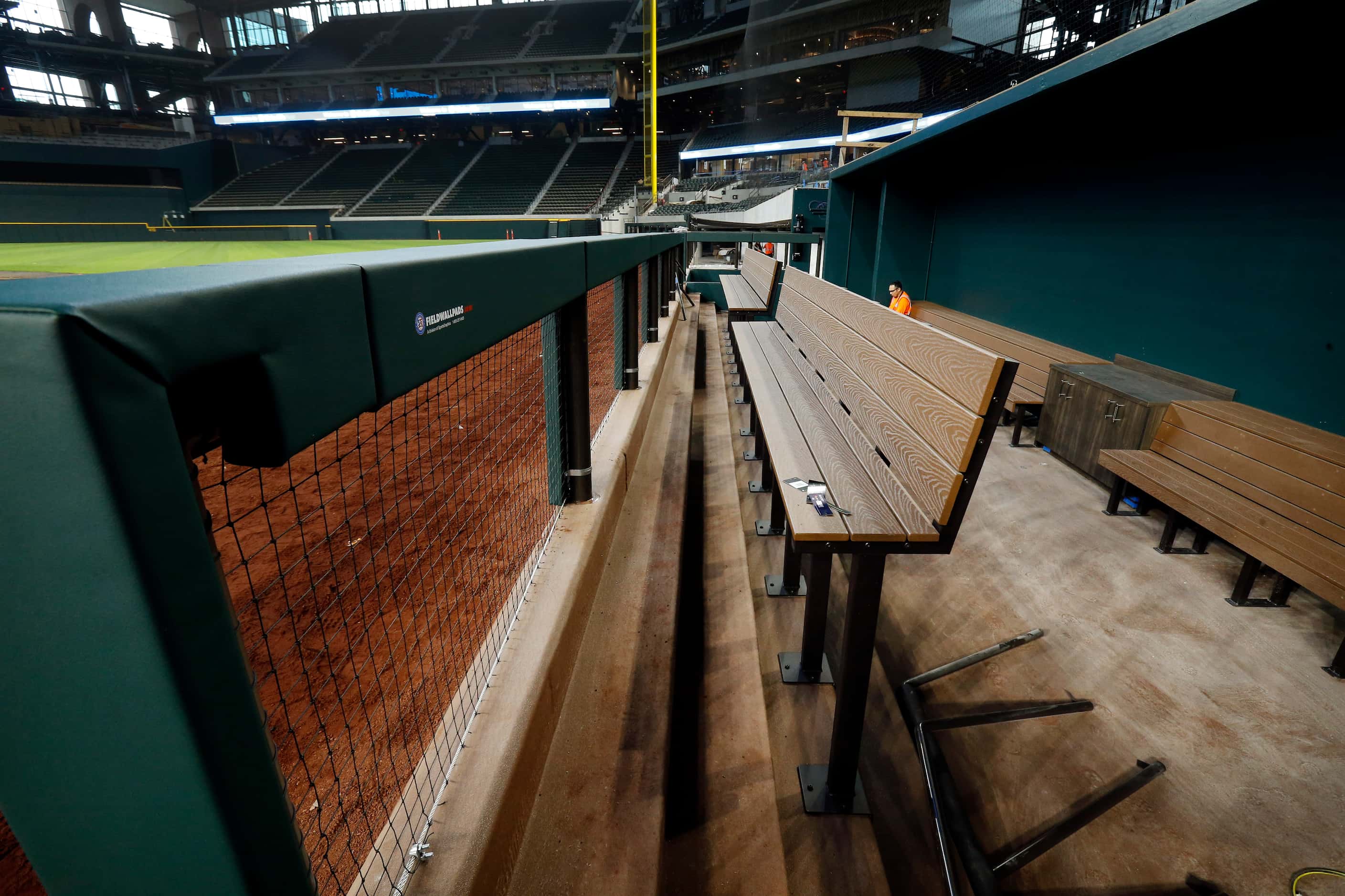 The Texas Rangers dugout is nearing completion inside the new Globe Life Field under...