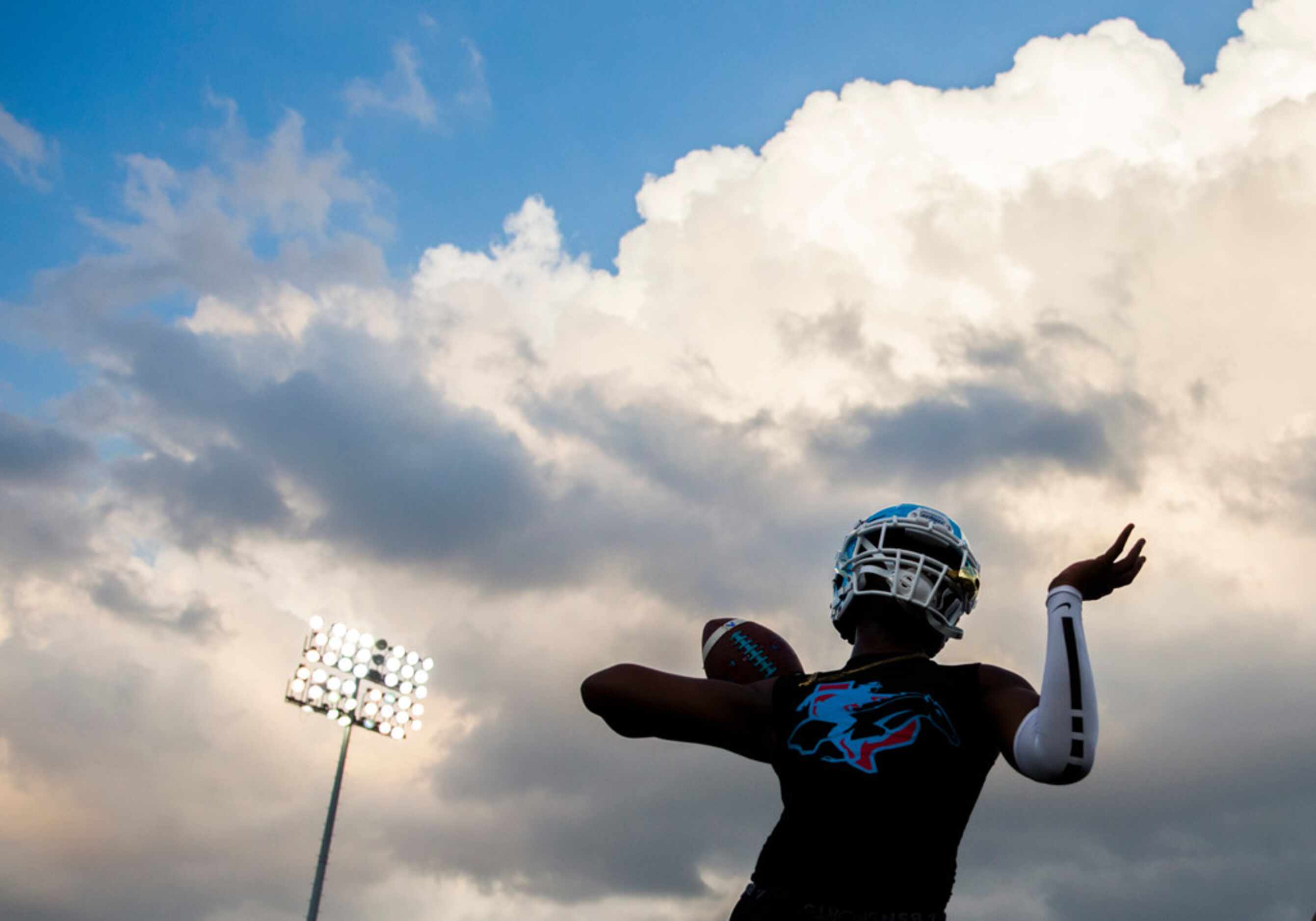 A Skyline football player warms up before a high school football game between Skyline and...