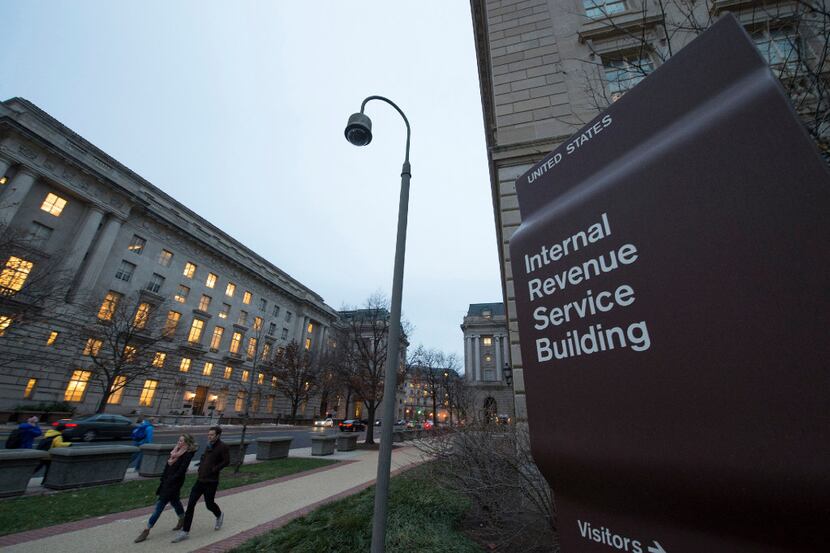 Workers enter the IRS building on Dec. 11, 2014, in Washington, D.C. 