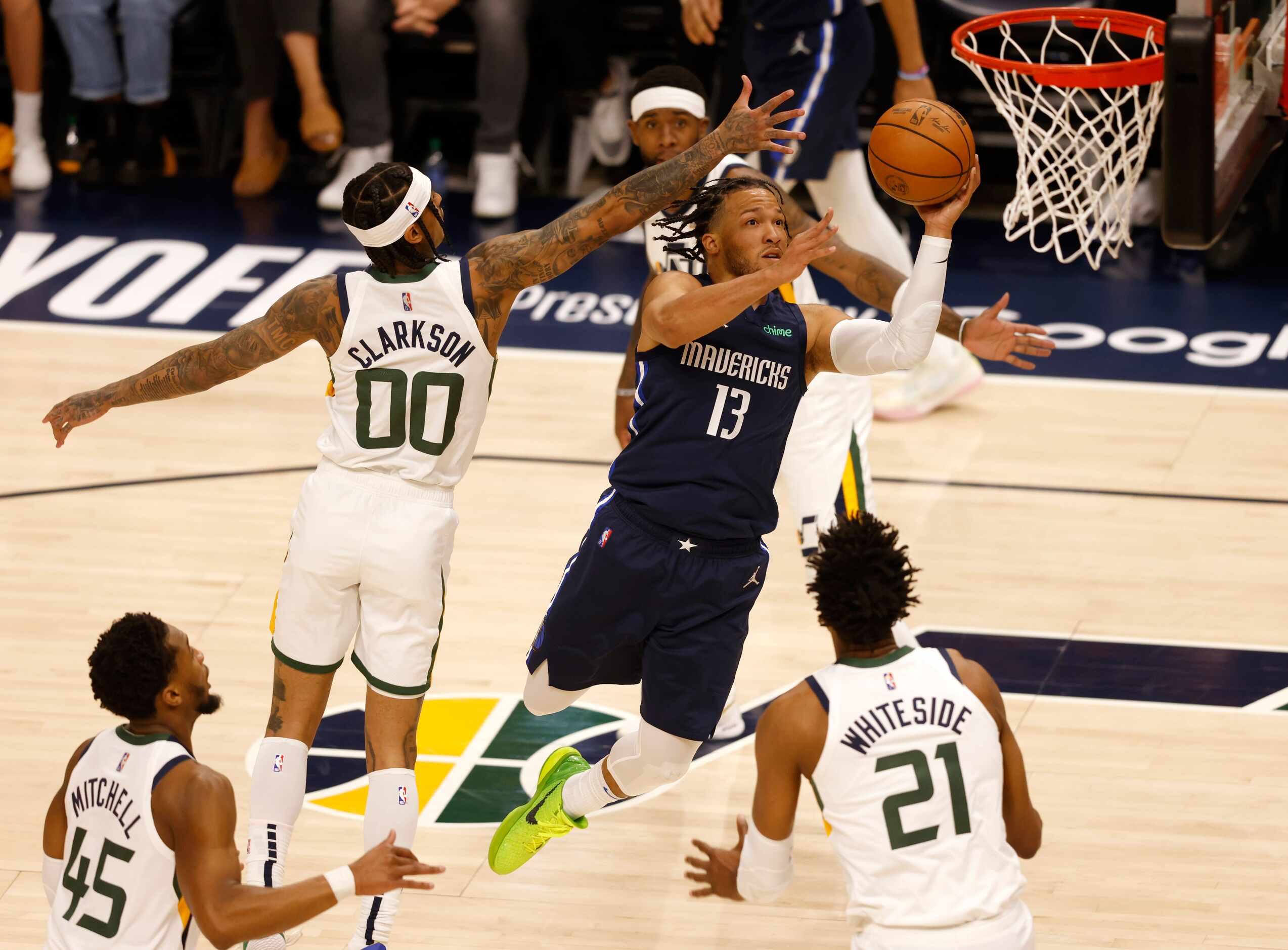 Dallas Mavericks guard Jalen Brunson (13) attempts a shot in between Utah Jazz guard Jordan...