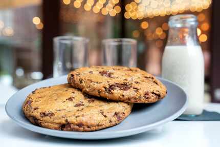 Chocolate chip cookies are served with oat milk at Belse Plant Cuisine.