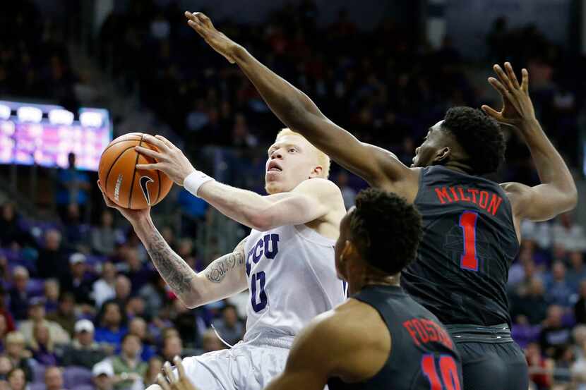 TCU Horned Frogs guard Jaylen Fisher (0) drives to the basket as Southern Methodist Mustangs...