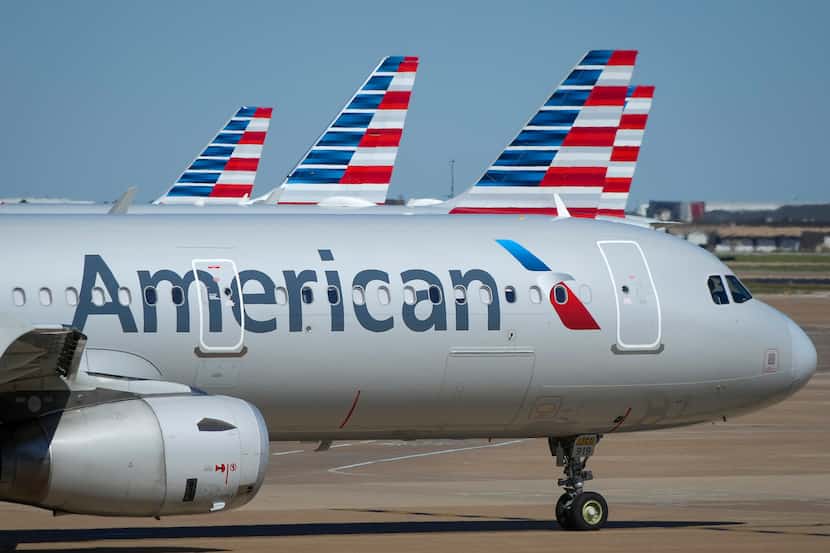 American Airlines planes at the gates of Terminal C at DFW International Airport.
