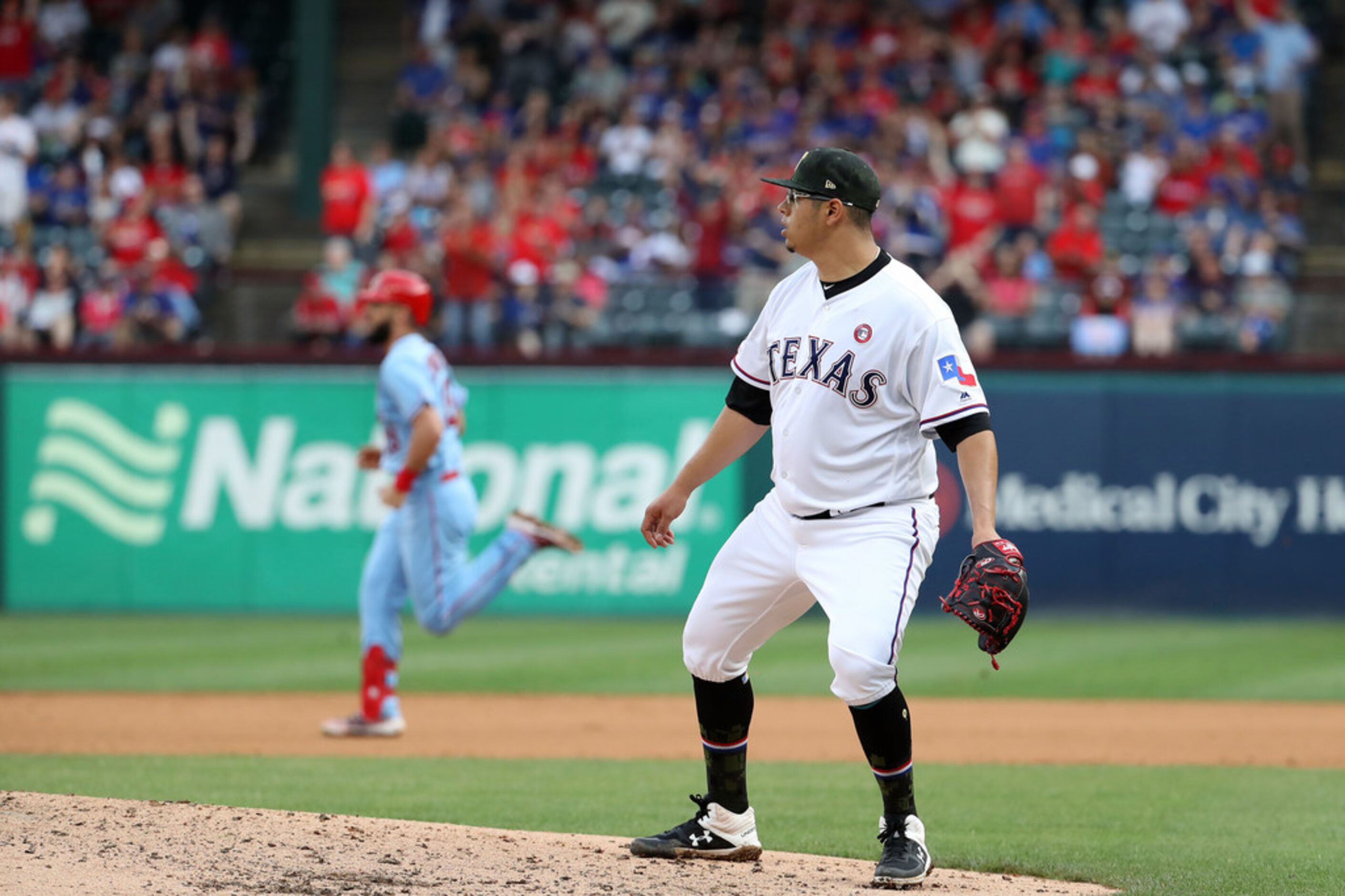 ARLINGTON, TEXAS - MAY 18:  Ariel Jurado #57 of the Texas Rangers gives up a rbi double to...