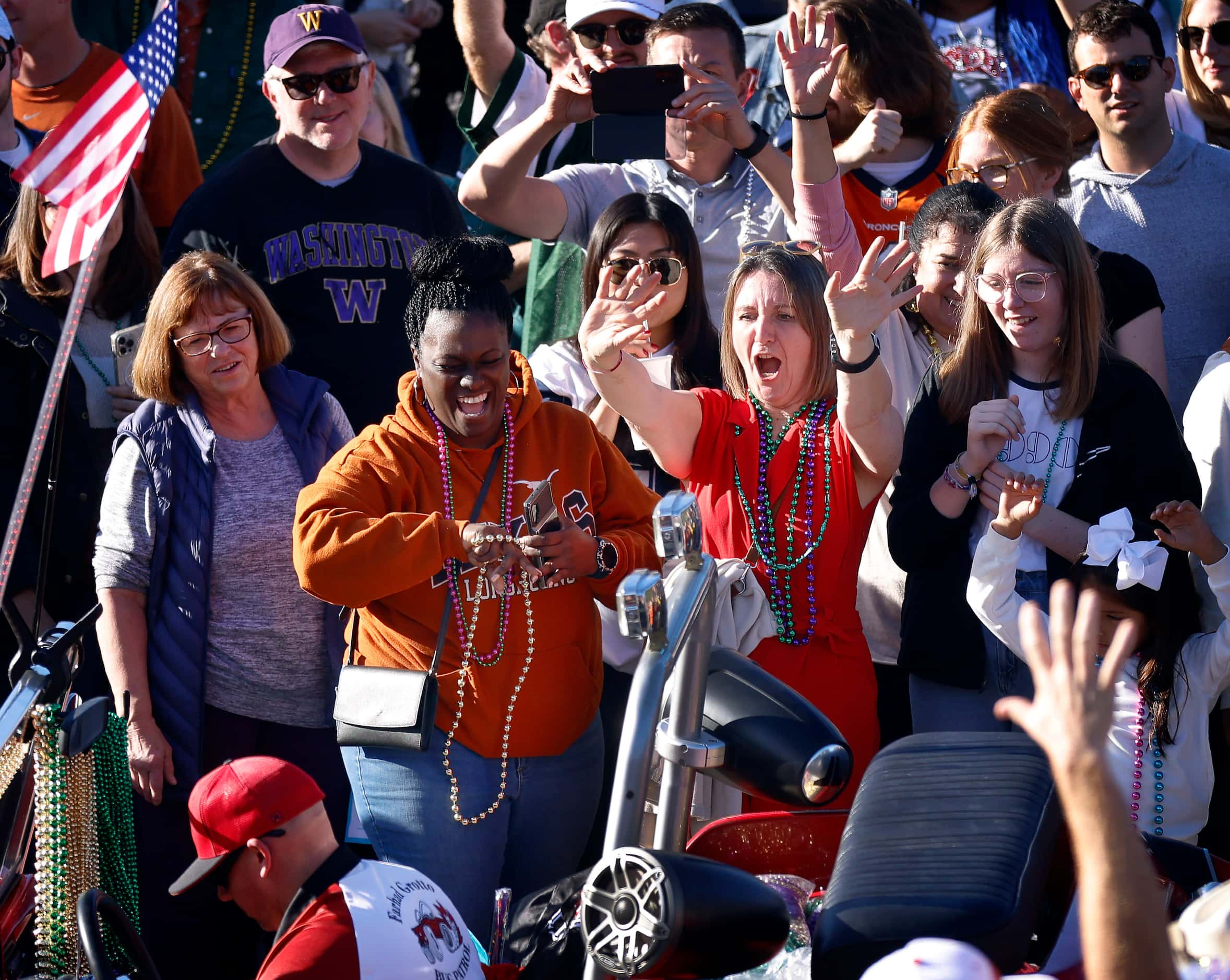 Texas Longhorns fans scream for beads during the Mardi Gras-style Allstate Sugar Bowl New...