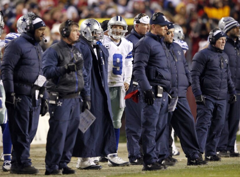 Dallas Cowboys quarterback Tony Romo (9) looks back at the scoreboard after failing to make...