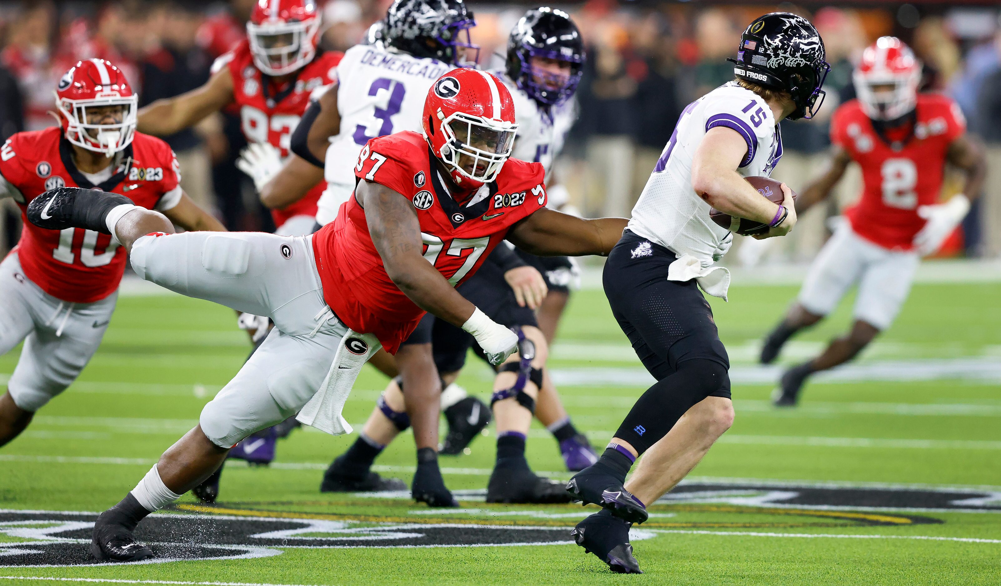 Georgia Bulldogs defensive lineman Warren Brinson (97) attempts to sack TCU Horned Frogs...