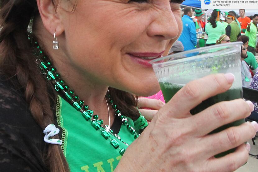 Dawn Cruzani wasn't sure about the green beer being served in the beer garden at Frisco...