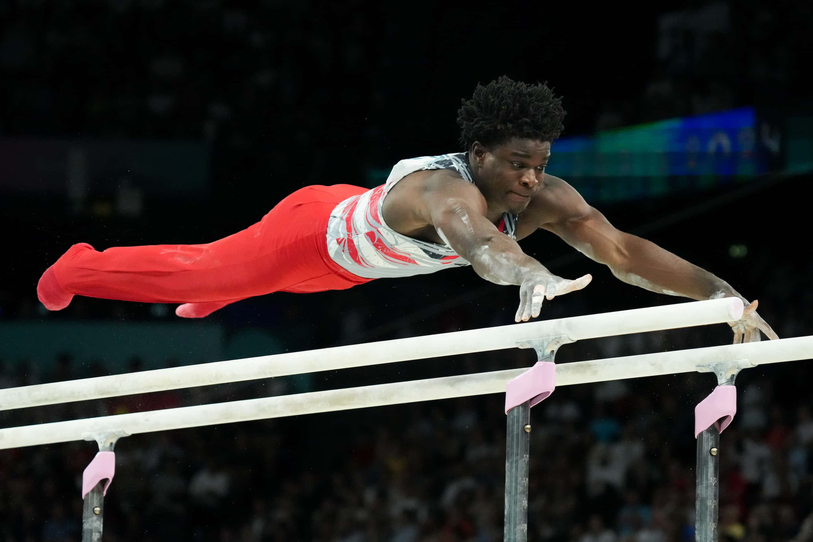 Frederick Richard of the United States competes on the parallel bars during the men’s...