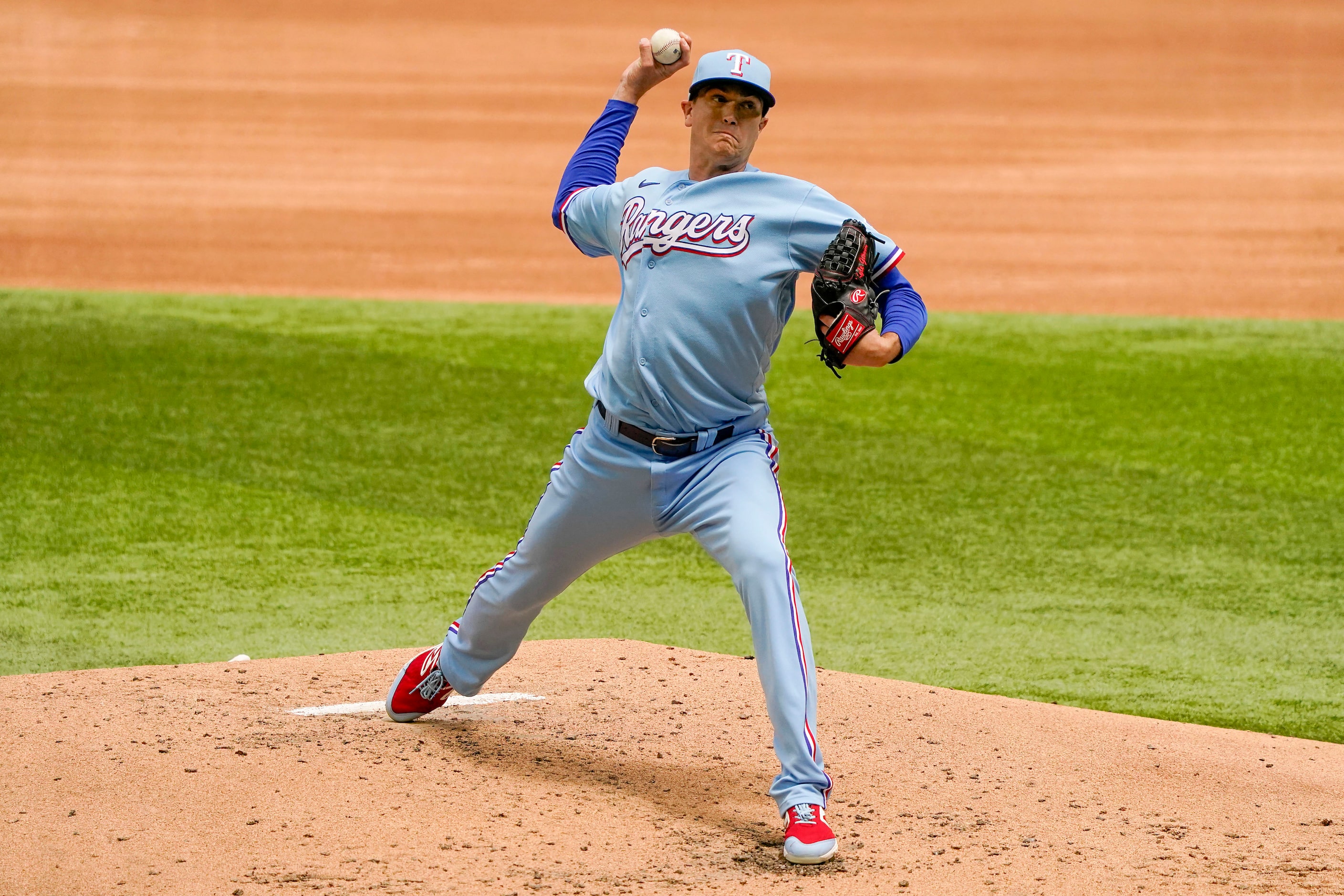 Texas Rangers pitcher Kyle Gibson delivers during the third inning against the Baltimore...