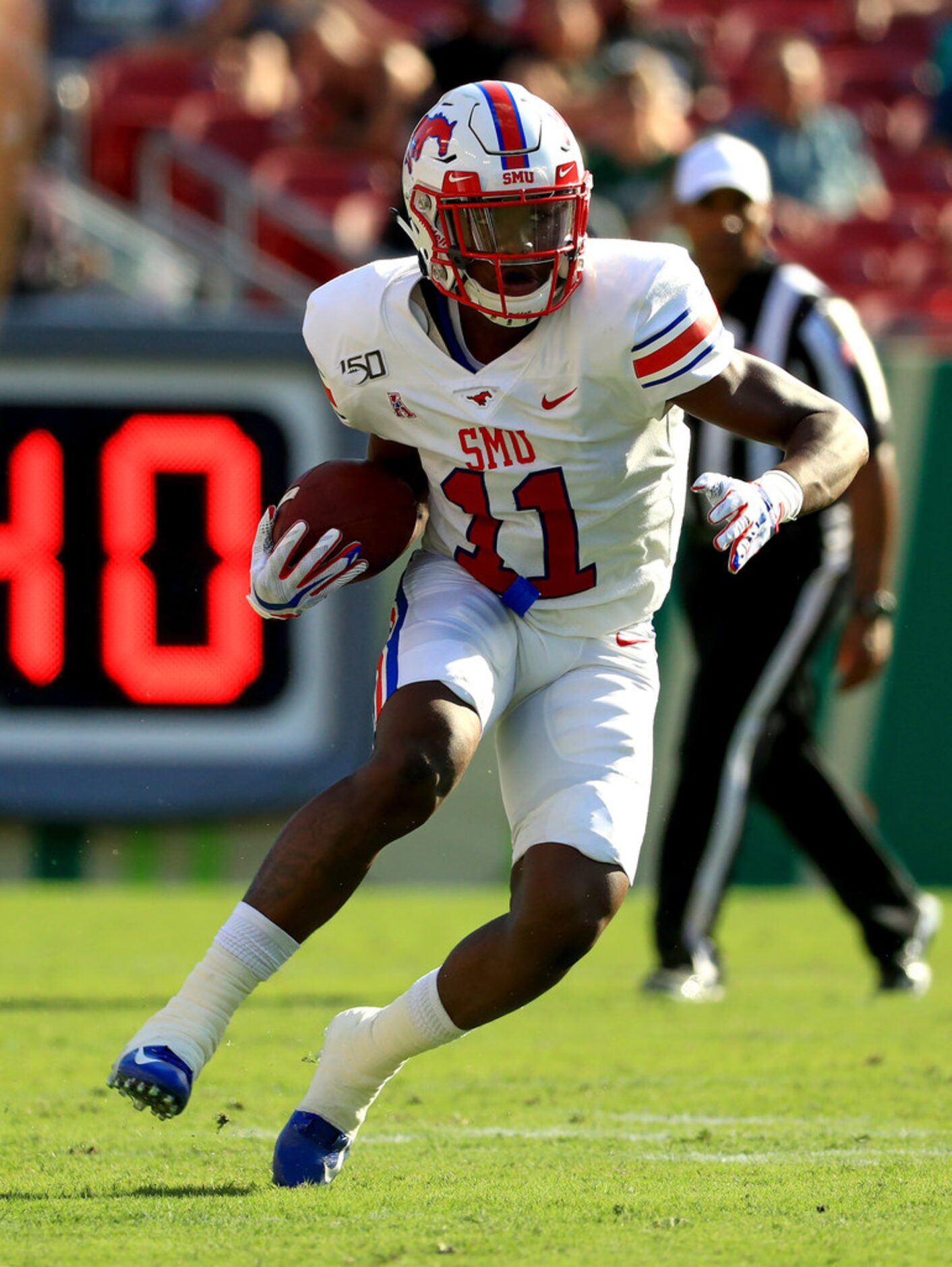 TAMPA, FLORIDA - SEPTEMBER 28: Rashee Rice #11 of the Southern Methodist Mustangs runs after...