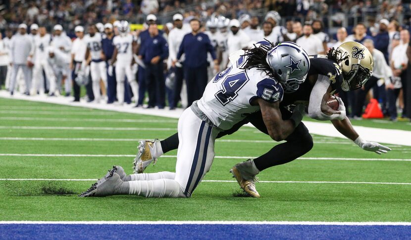 Dallas Cowboys middle linebacker Jaylon Smith (54) stops New Orleans Saints running back...