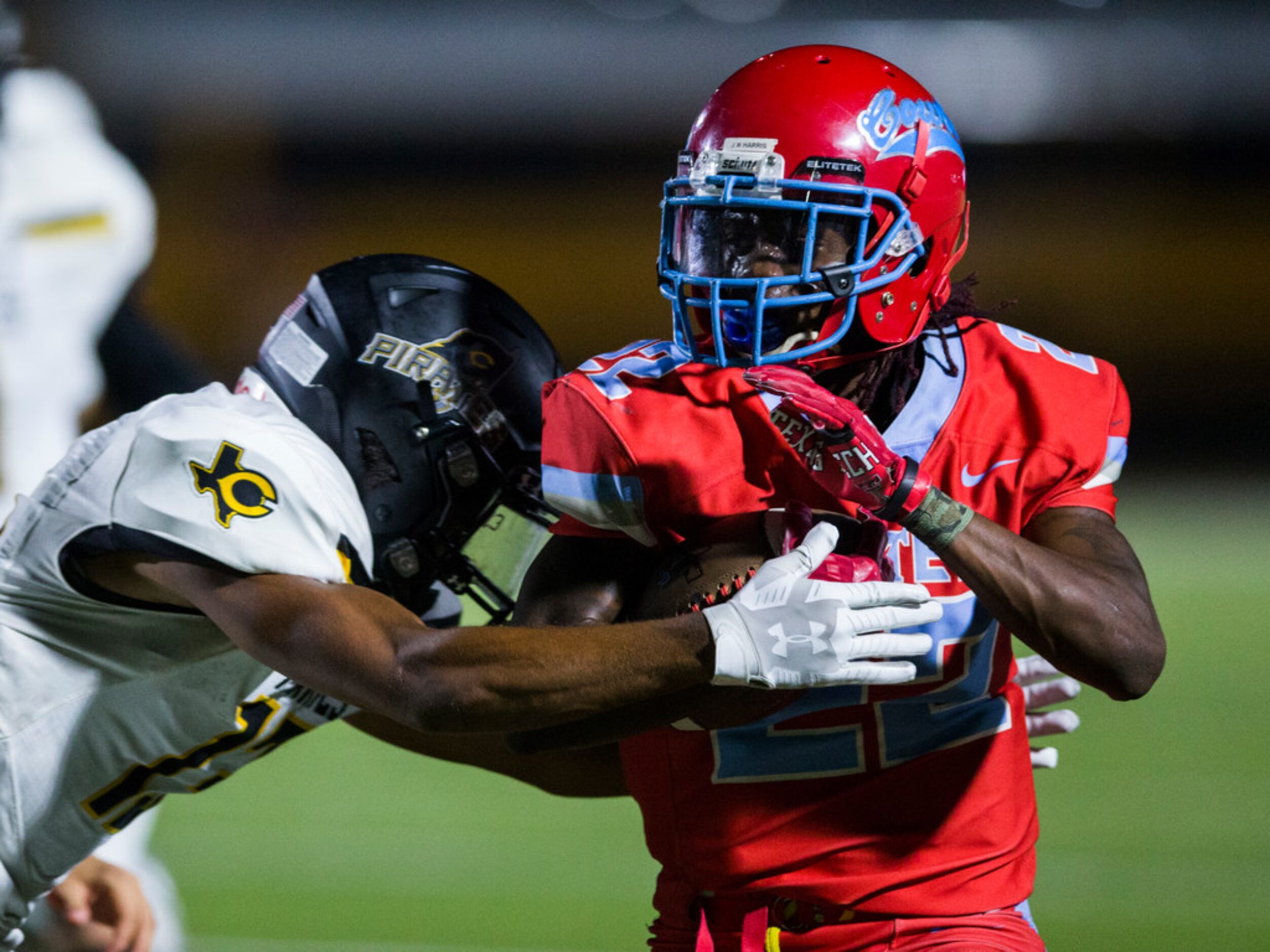 Carter running back Justise Wade-Harris (22) is tackled by Crandall defensive back Seth...