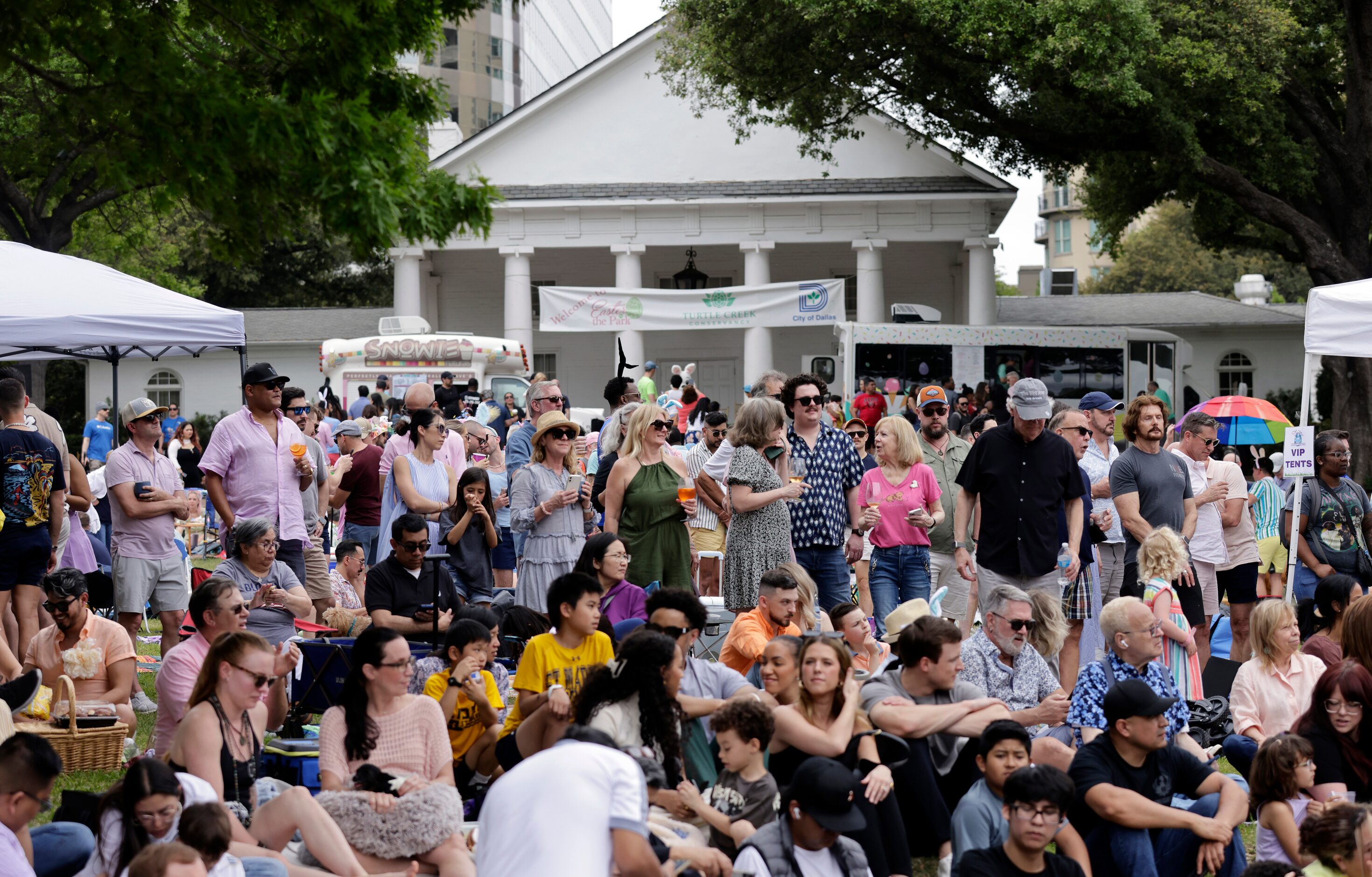 People gathered on the Oak Lawn Park knoll to watch the Pooch Parade at Easter in Turtle...