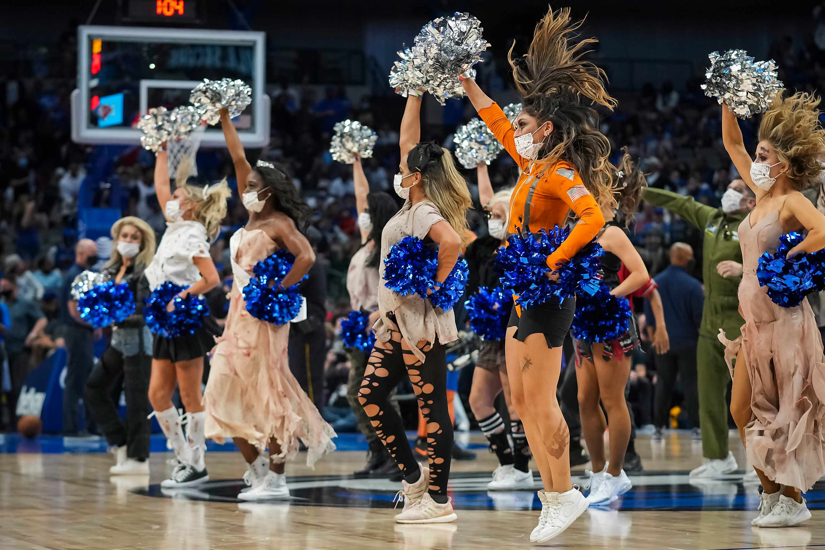 Dallas Mavericks dancers perform during the second half of an NBA basketball game against...