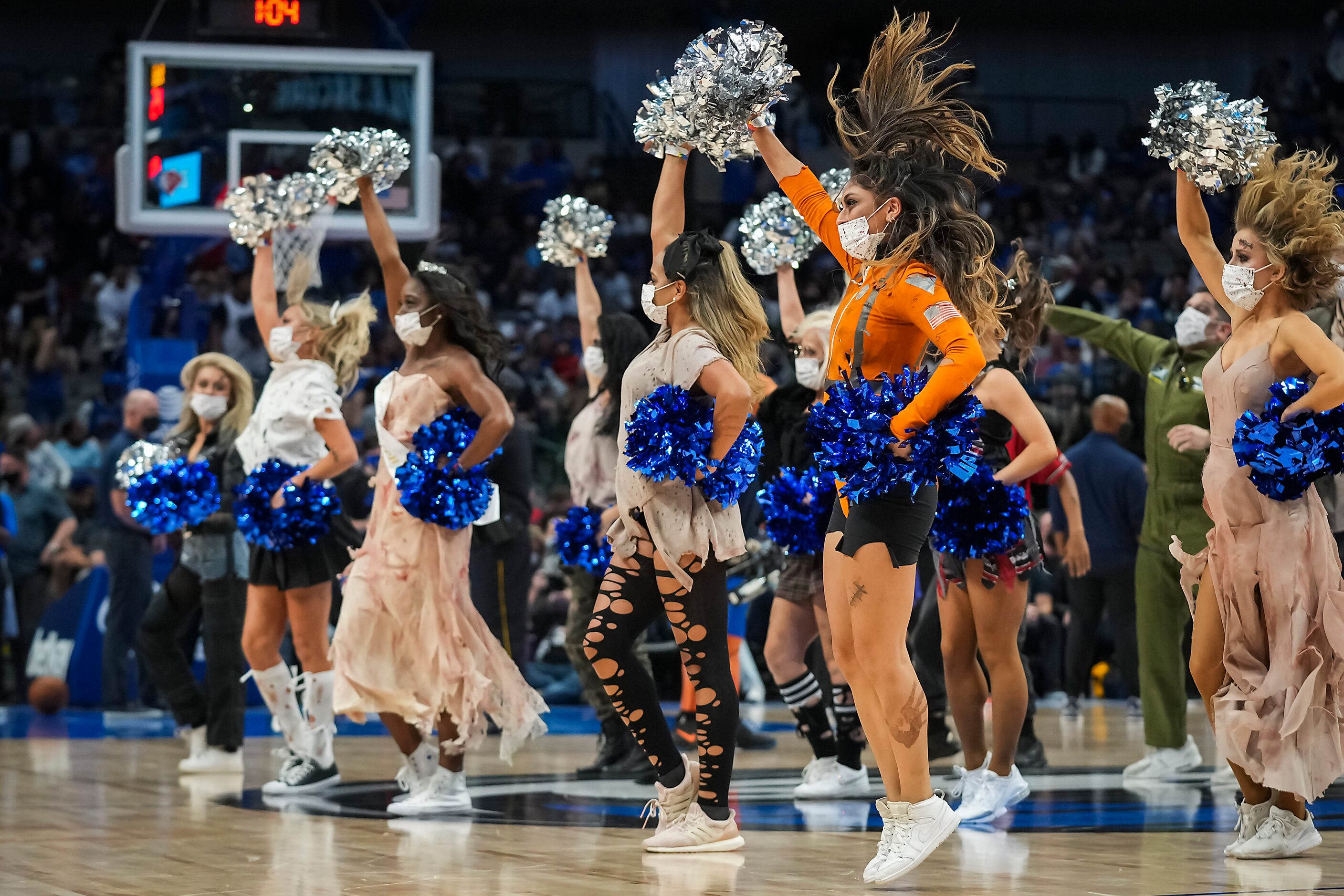 Dallas Mavericks dancers perform during the second half of an NBA basketball game against...