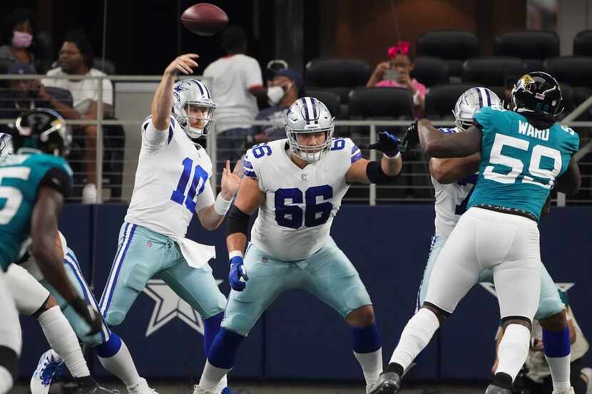 Dallas Cowboys quarterback Cooper Rush (10) throws a pass as offensive guard Connor McGovern...