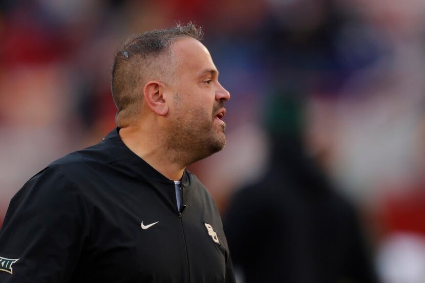 Baylor head coach Matt Rhule directs his players during warmups before an NCAA college...