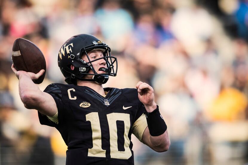 Wake Forest quarterback John Wolford passes in the third quarter of an NCAA football game...