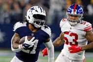 Dallas Cowboys running back Ezekiel Elliott (21) gets around New York Giants linebacker...