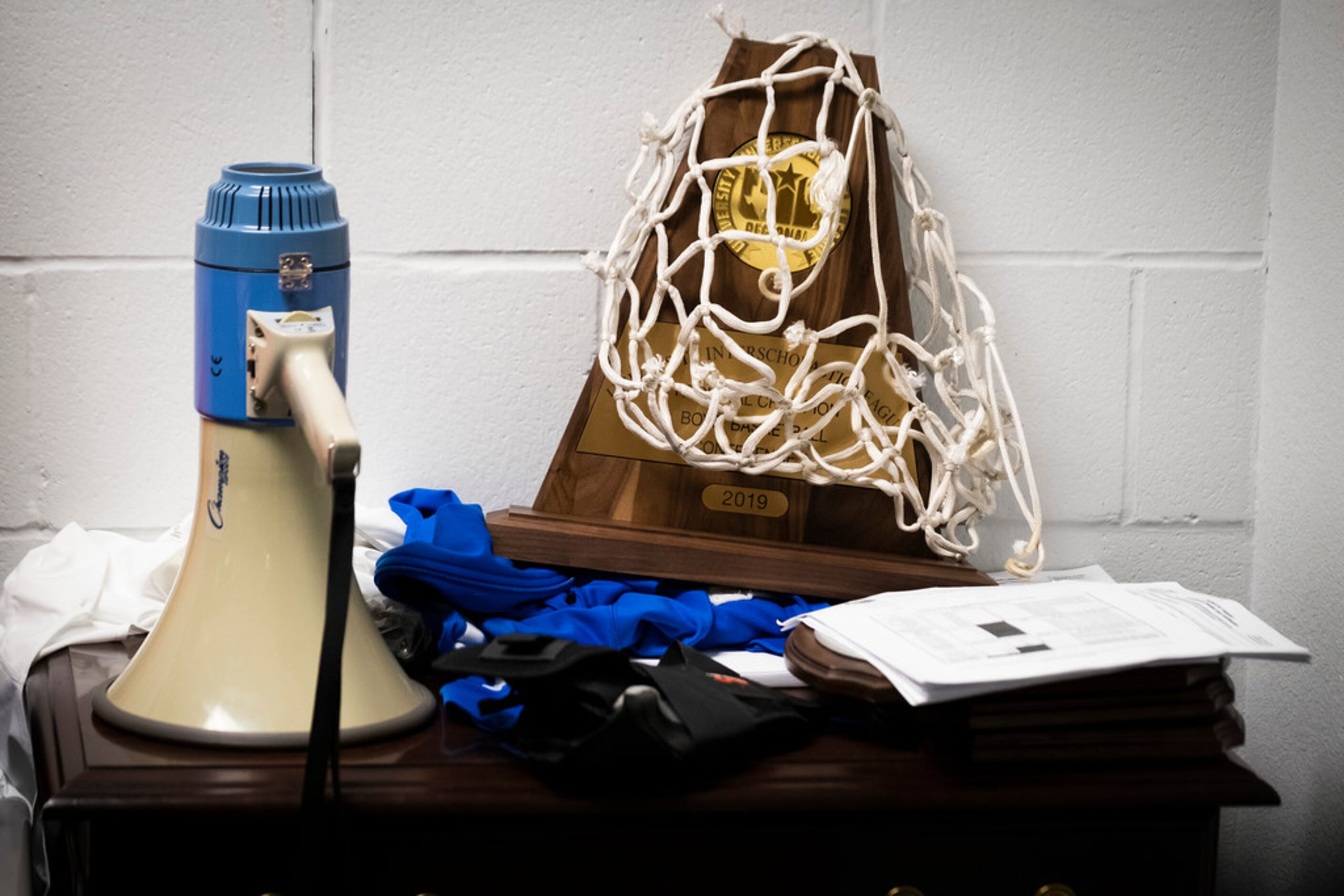 The team's 2019 UIL Regional Championship trophy sits in Slidell High School head coach...