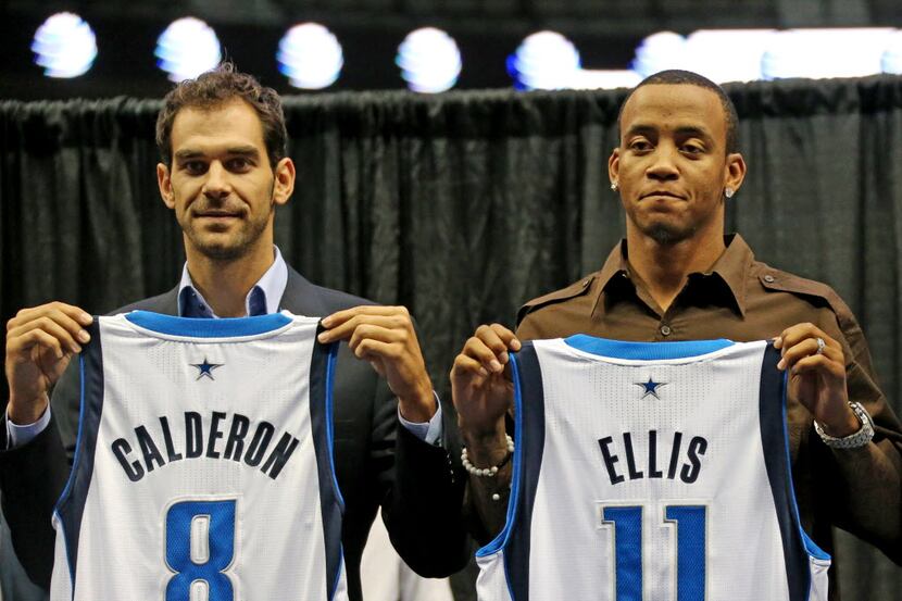 New Dallas Mavericks players Jose Calderon and Monta Ellis pose with their jerseys at a...