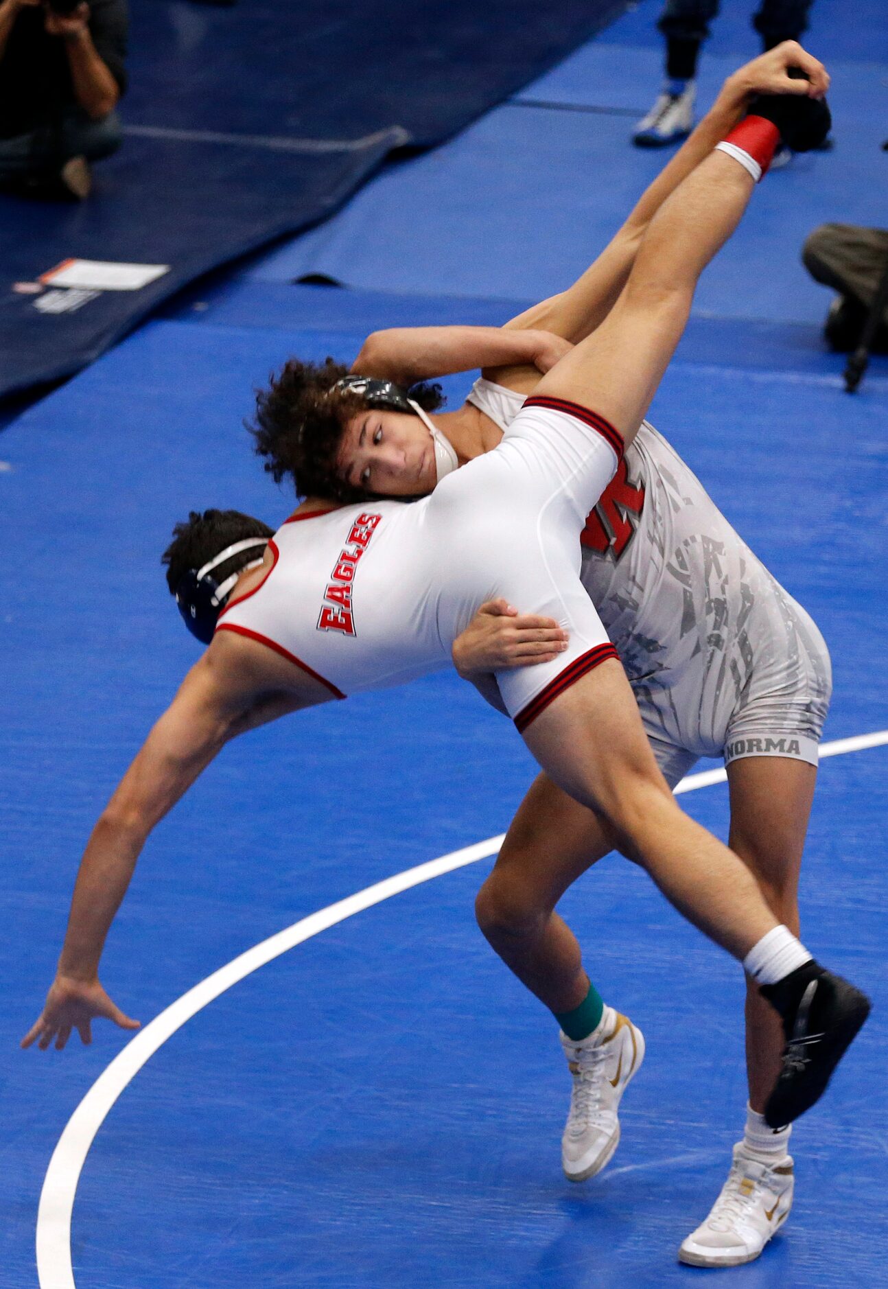 Cedar Park Vista Ridge wrestler Aaron Lofton throws Allen High Eagles Alejandro Cavazos to...