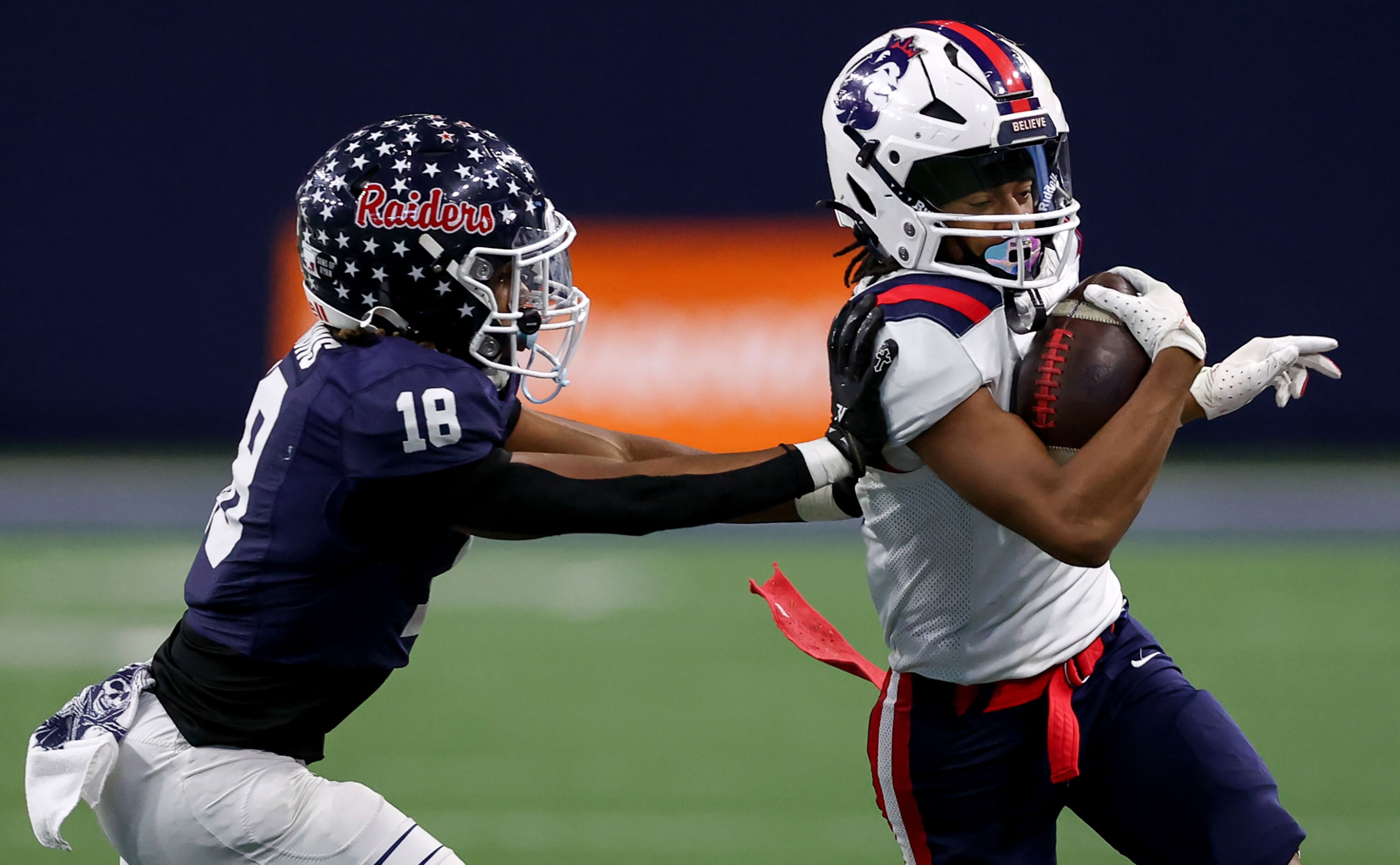 Richland wide receiver Aaron Brooks (right) tries to get past Denton Ryan defensive back...