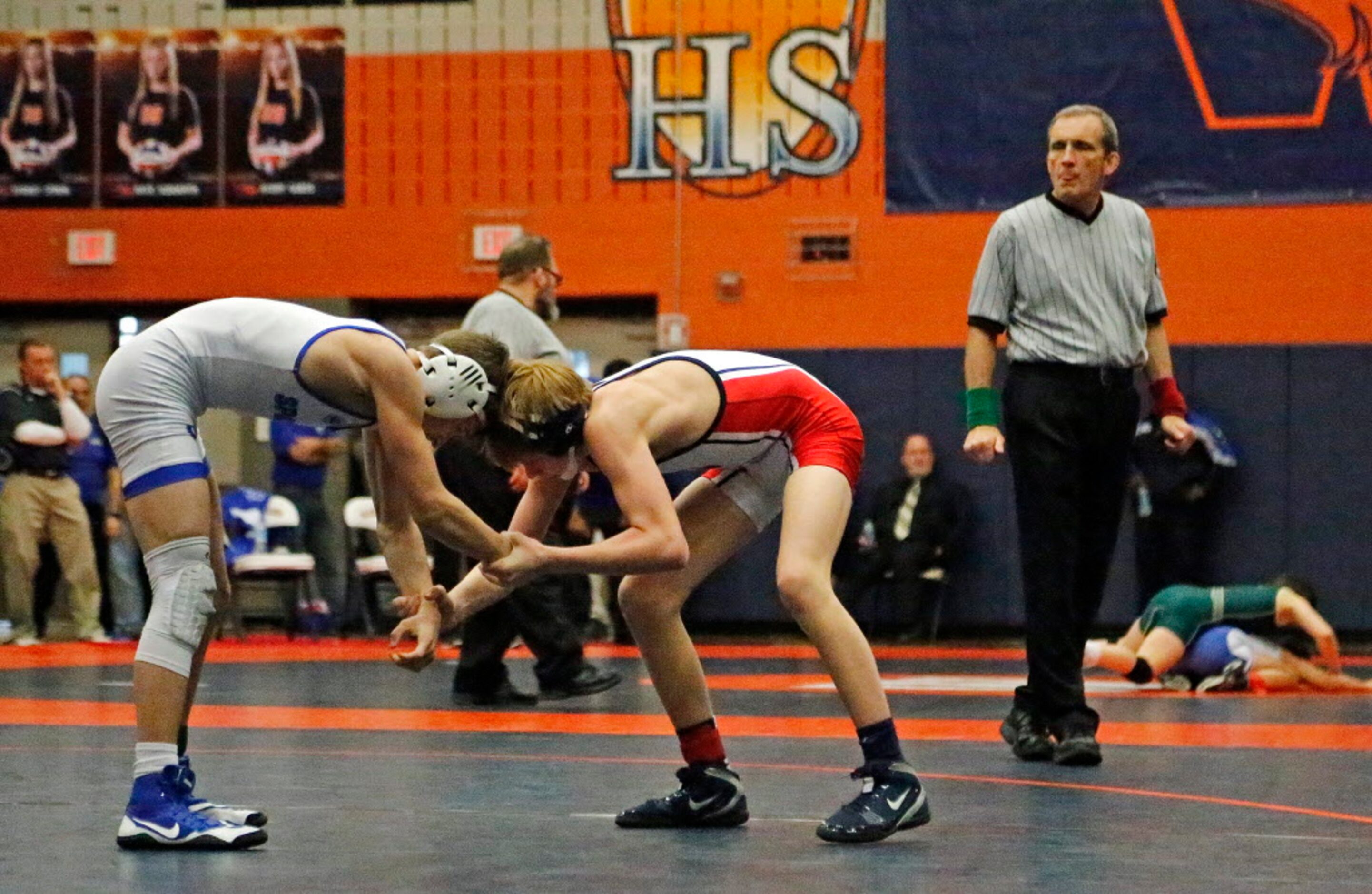 Tyten Volk of Frisco Centennial High School competes with Wesley Goleman (left) of Burleson...