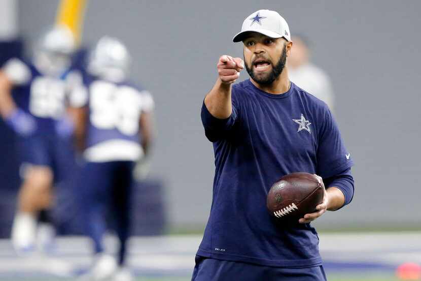 Dallas Cowboys defensive backs coach Kris Richard gives instruction to his players during...