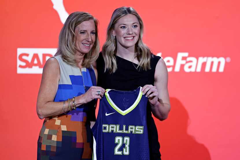 Iowa State's Ashley Joens, right, poses for a photo with commissioner Cathy Engelbert after...