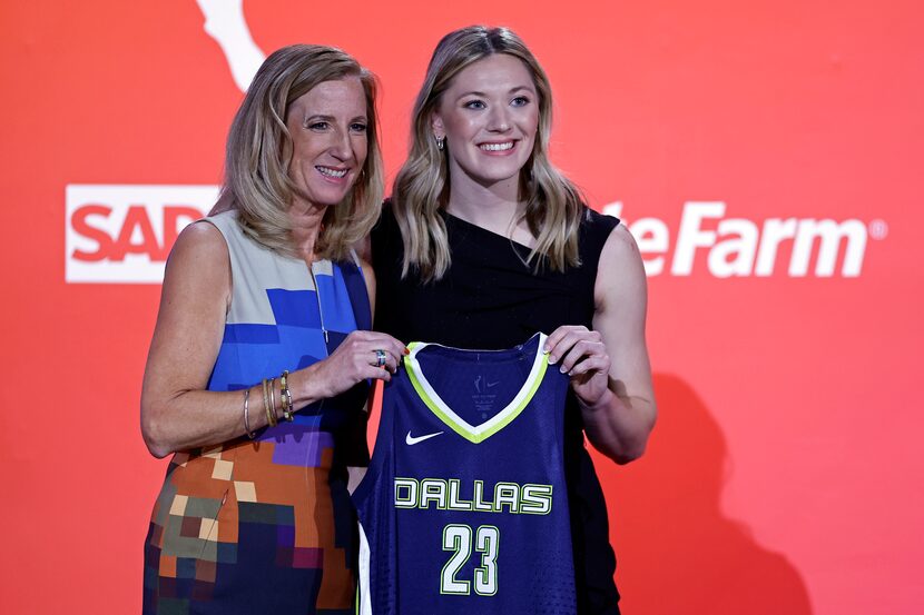 Iowa State's Ashley Joens, right, poses for a photo with commissioner Cathy Engelbert after...