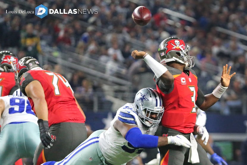 Dallas Cowboys defensive tackle Terrell McClain (97) forces a fumble from Tampa Bay...