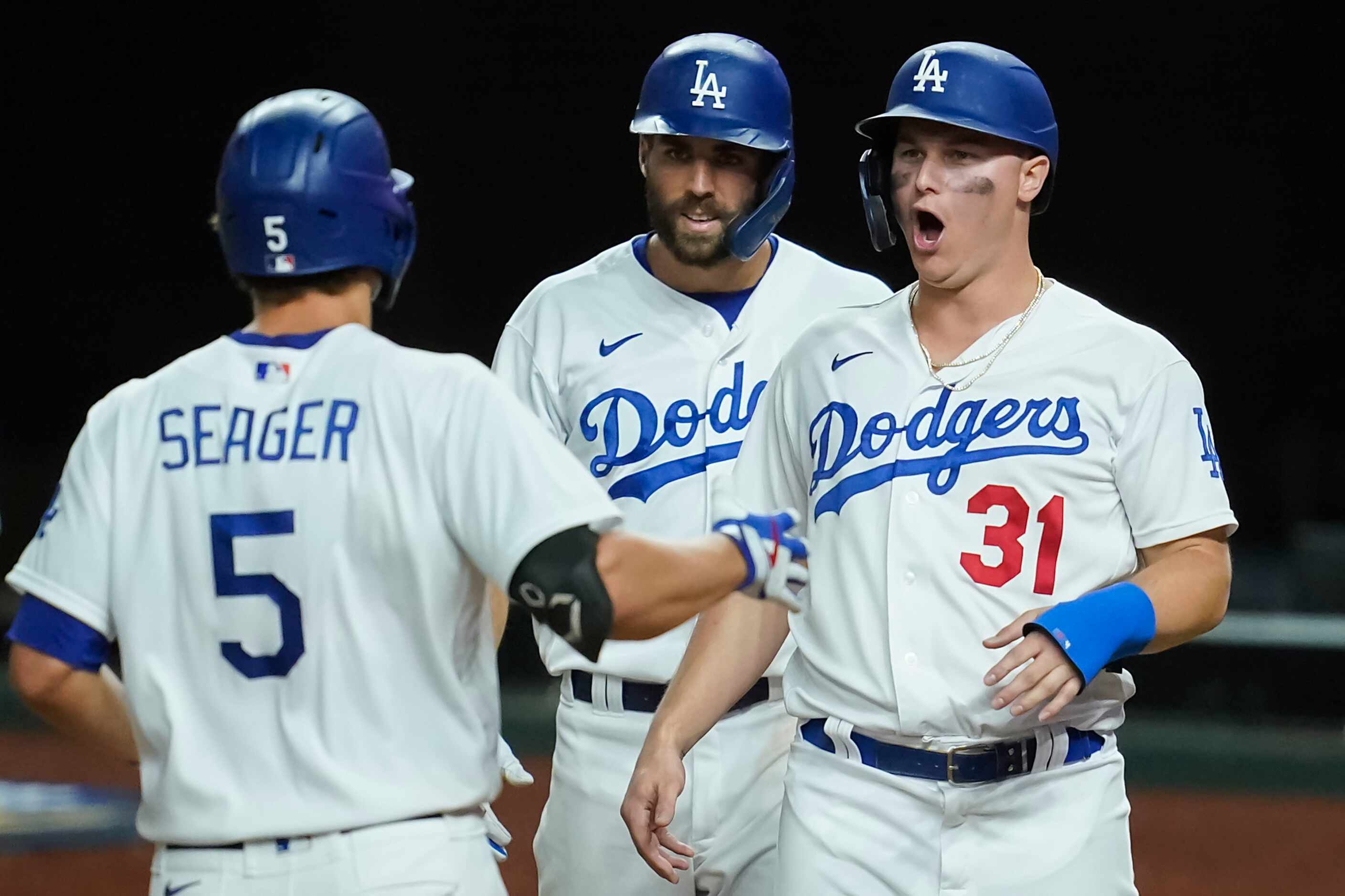 Los Angeles Dodgers shortstop Corey Seager celebrates with designated hitter Joc Pederson...