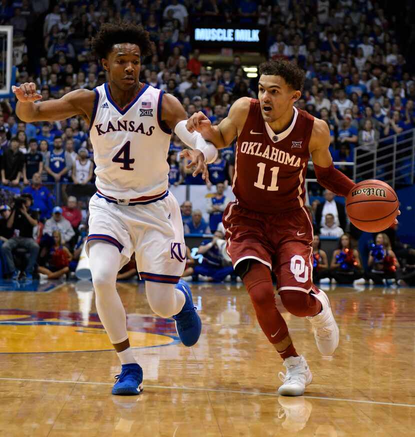 LAWRENCE, KS - FEBRUARY 19: Trae Young #11 of the Oklahoma Sooners drives to the basket as...