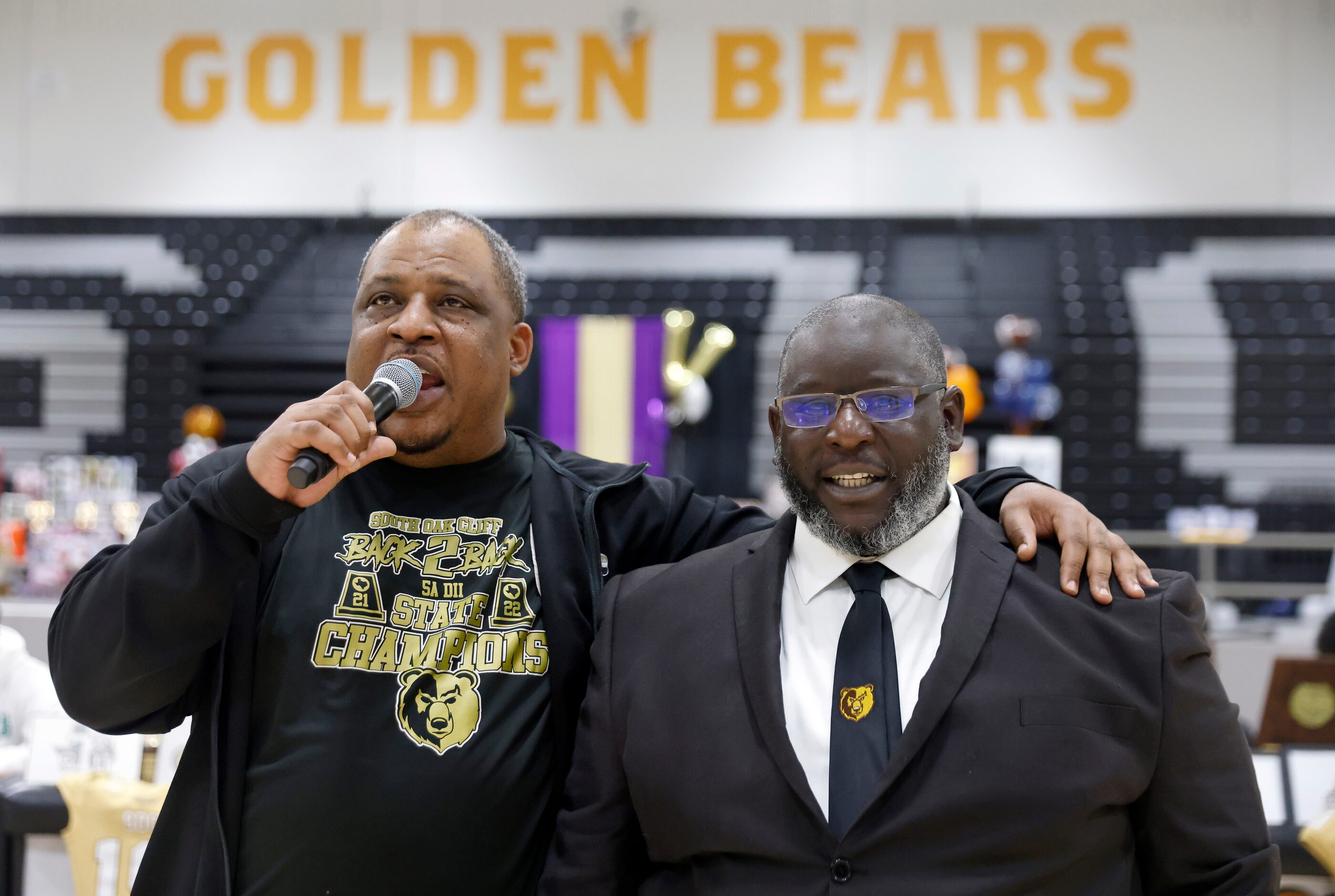 South Oak Cliff head coach Jason Todd (left) thanks defensive line coach Michael Traylor for...