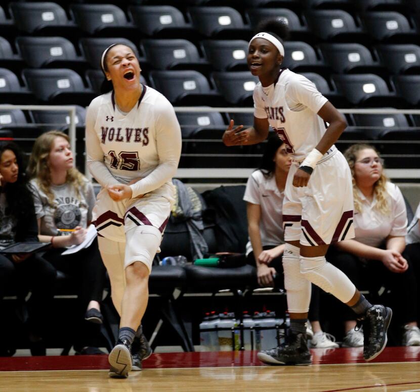 Mansfield Lady Wolves guard Chennedy Carter (15) celebrates with teammate guard Trelynn...