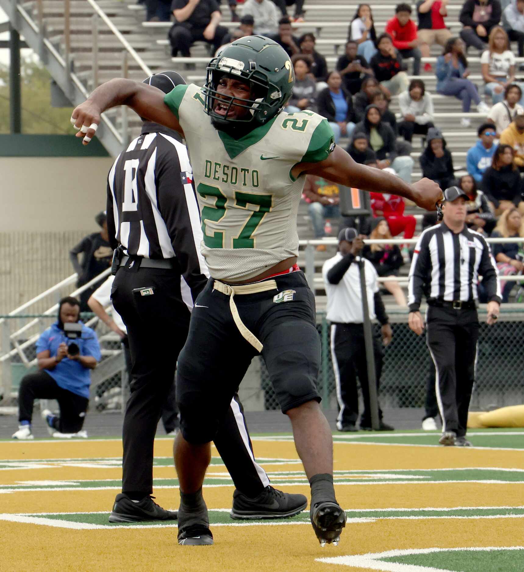 DeSoto running back Marvin Duffy (27) reacts after scoring a touchdown during first half...
