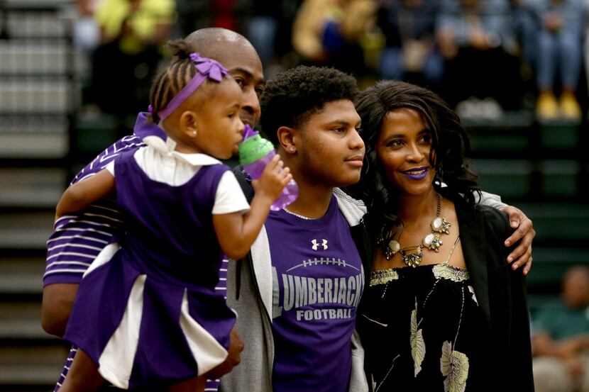 DeSoto's Terrance Shaw poses for a photograph with his family before signing with Stephen F....