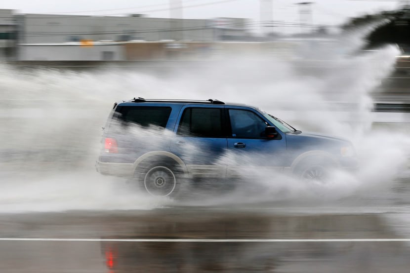 Motorists along northbound Interstate 35 in Carrollton navigate the rainy roads Wednesday.
