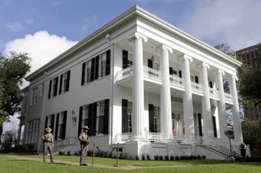 Texas state troopers guard the Texas Governor's Mansion.