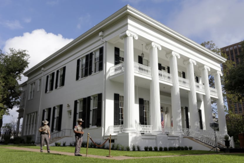 Texas state troopers guard the Texas Governor's Mansion in this file photo taken on August...
