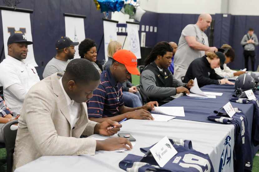 Frisco Lone Star football players sign their letters of intent on national signing day in...