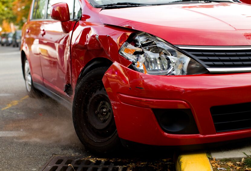 Car Accident Detail of a smashed front red car.