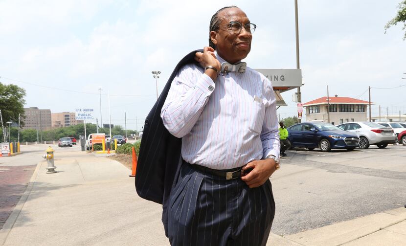 Dallas County Commissioner John Wiley Price looks downtown Dallas before leaving his office...